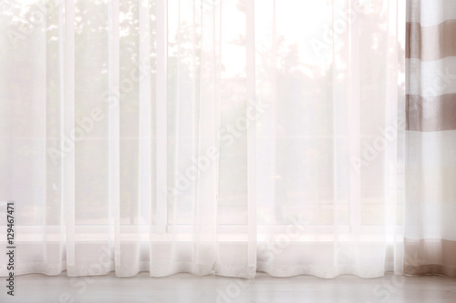 New elegant curtain on window