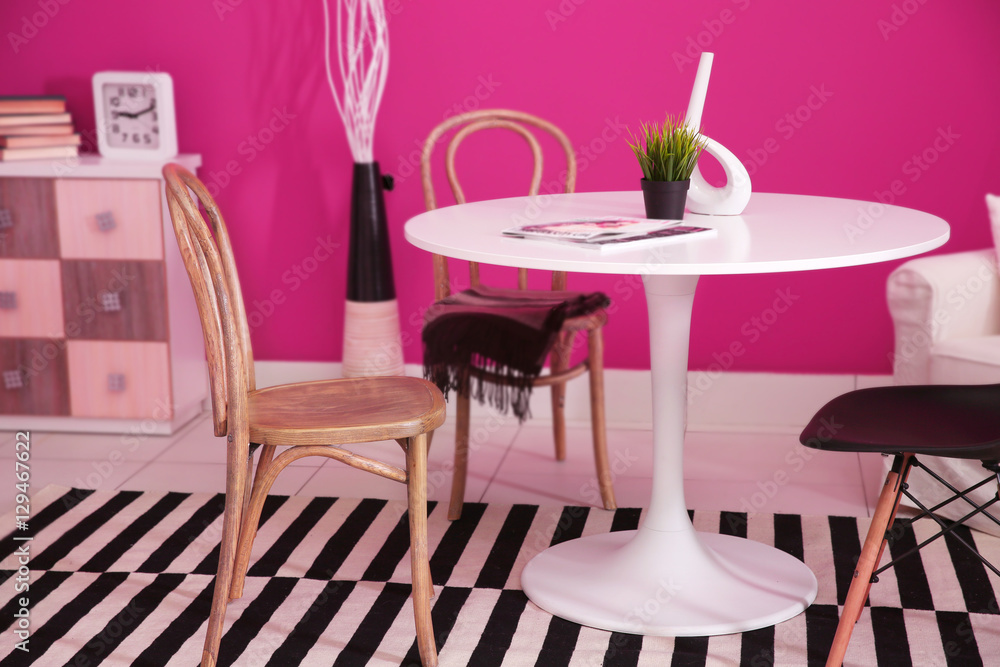 Modern interior on pink wall background Modern interior on pink wall background