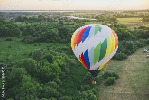 Balloon on a background of the beautiful green landscape