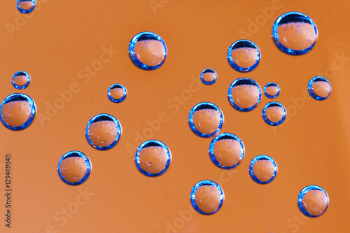 Texture of blue air bubbles on orange backgroud