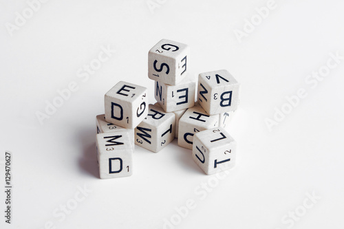   letters and numbers on cubes white background photo