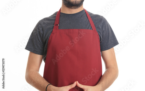 Tableau sur toile Young man with red apron