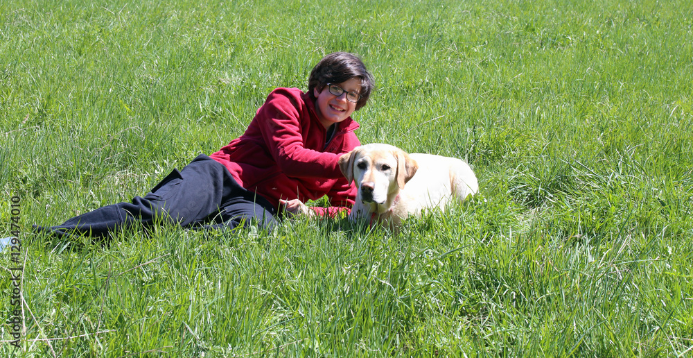 young boy together with his dog Labrador Retriever young boy together with his dog Labrador Retriever