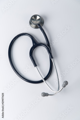 Stethoscope close up view. Stethoscope with reflection. Stethoscope background. Stethoscope with reflection on glossy background.