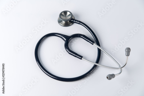 Stethoscope close up view. Stethoscope with reflection. Stethoscope background. Stethoscope with reflection on glossy background.