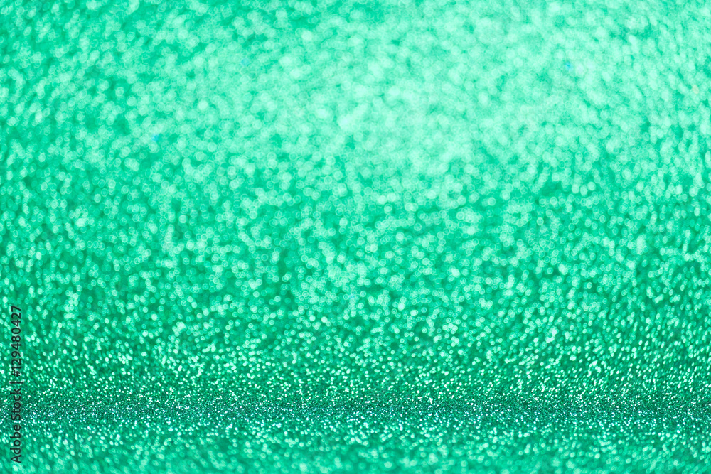 Obraz premium Defocused green glitter background