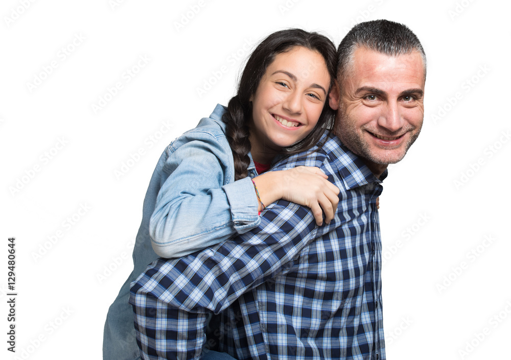 Father standing and carrying girl on his back Father standing and carrying girl on his back