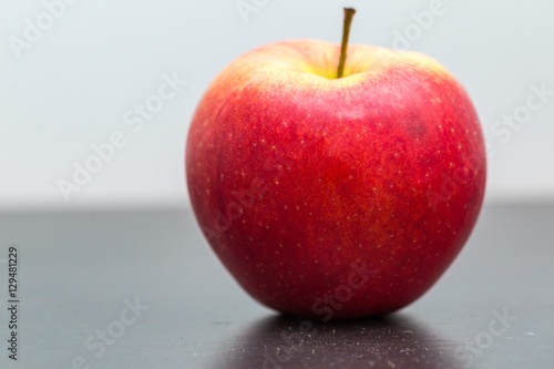 Apple lying on dark table