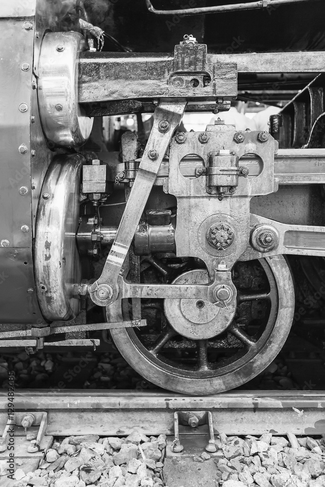 Steam locomotive wheels or steam train wheels and rods closeup for background and design with copy space for text and image.