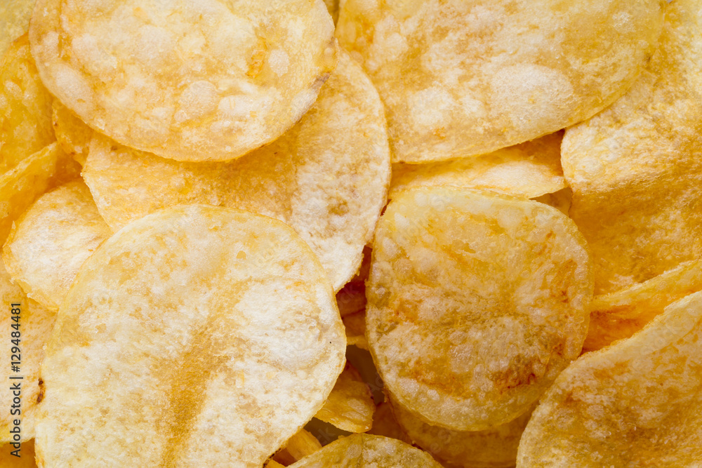 Close up potato chips on wood top view background. Close up potato chips on wood top view background.