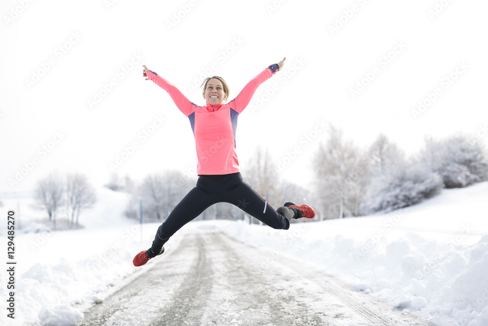 Fitness running woman in winter season Fitness running woman in winter season