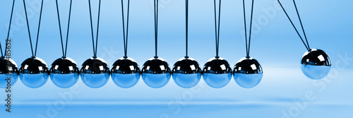 Картината върху платно cause and effect concept banner, metal Newton's cradle on a blue background