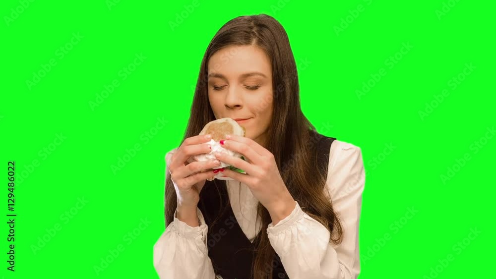 Girl eating hamburger Hiding that it could not be seen Girl eating hamburger Hiding that it could not be seen