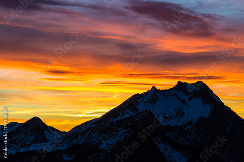 Vibrant sunset behind mountian