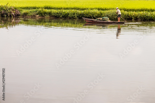 Vietnam fisherman standing on a boat