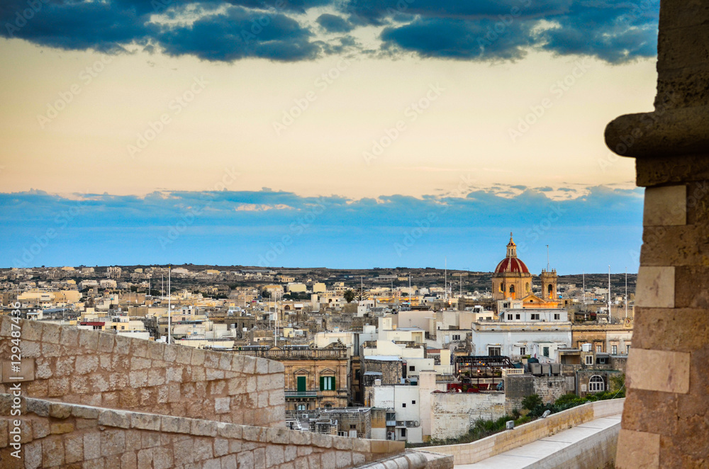 Sunset and the Victoria city skyline in Gozo, Malta