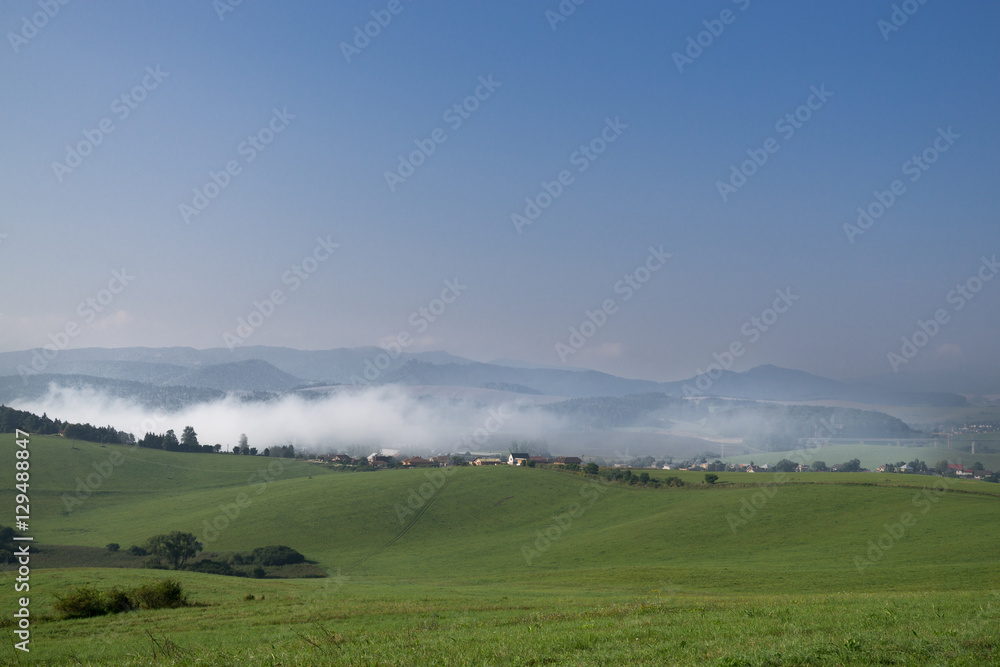 Misty morning with the view to the fog on meadow. Slovakia