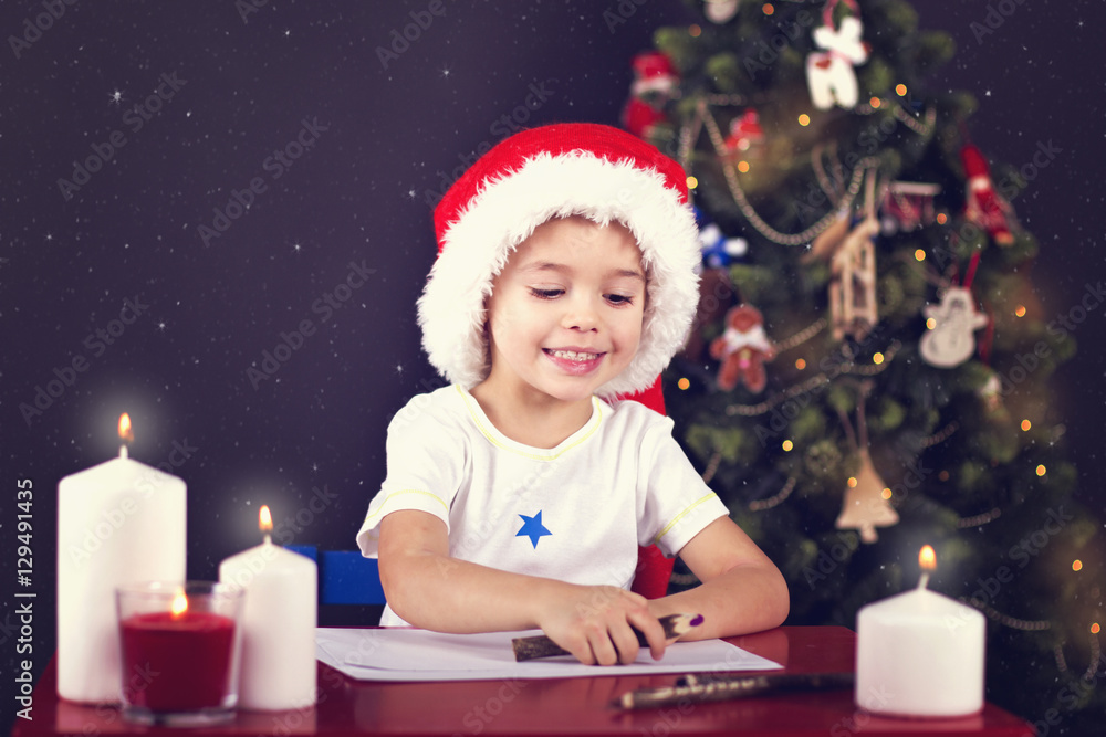 Christmas boy writing letter to Santa Christmas boy writing letter to Santa