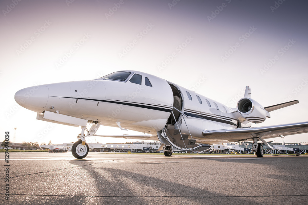 Private jet ready for boarding/Luxury business jet with open door ready for passenger boarding Private jet ready for boarding/Luxury business jet with open door ready for passenger boarding
