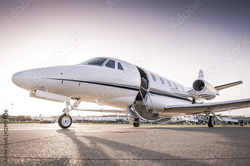 Private jet ready for boarding/Luxury business jet with open door ready for passenger boarding
