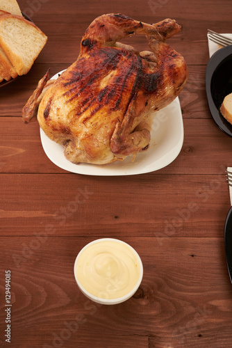 roasted bird on a wooden table