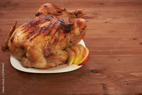 roasted bird on a wooden table