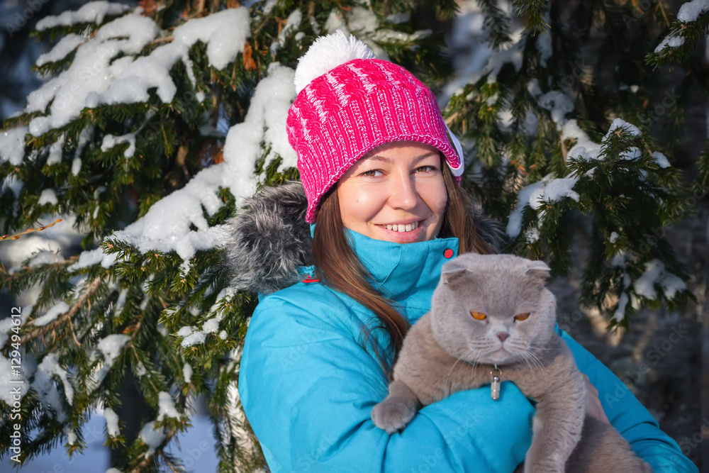 young woman with cat in winter young woman with cat in winter
