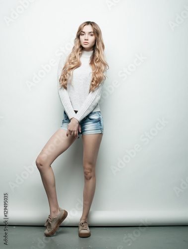 lifestyle, fashion and people concept: Full body young fashion woman model posing in studio