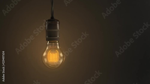 A 4K 3D animated loop of a single swinging vintage incandescent light bulb over a dark background. 8 seconds.