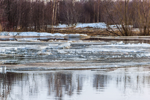 фотографія Early spring, the ice drift on the river.