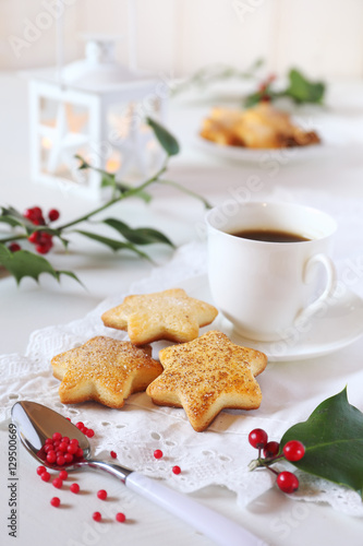  Christmas cookies, cup of coffee, holly and white lantern