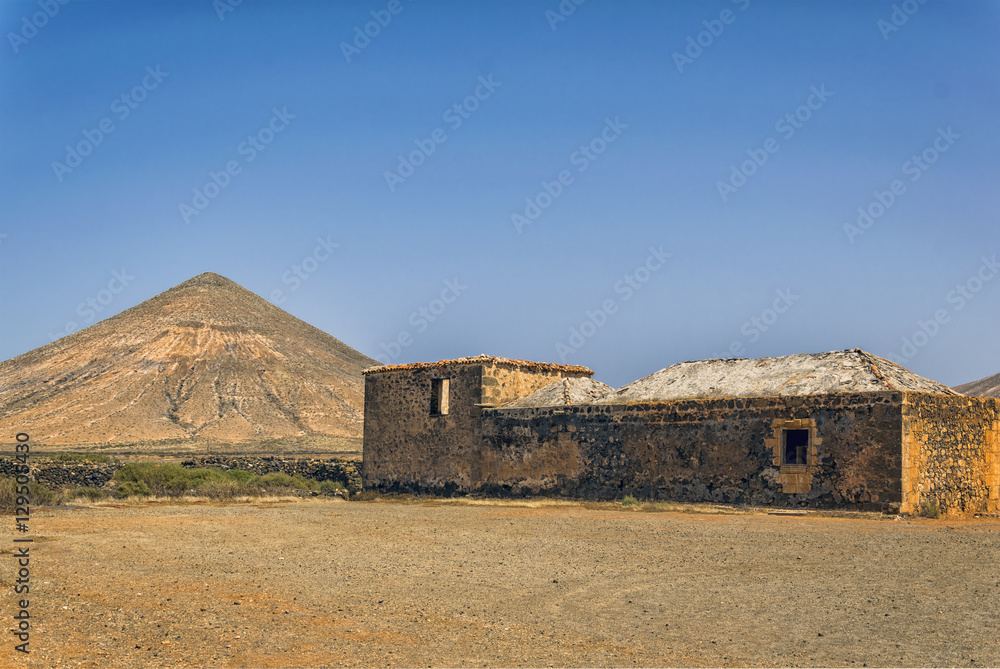 Daylight scene with clear sky and ancient ruins on Fuerteventura. 