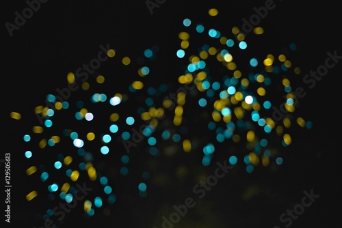 Light blur and defocus bokeh circles on black sky background