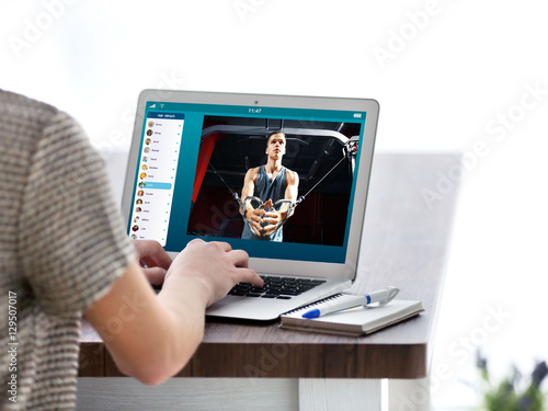 Woman watching sport traini...