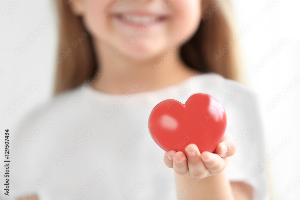 Little girl holding heart in her hand Little girl holding heart in her hand