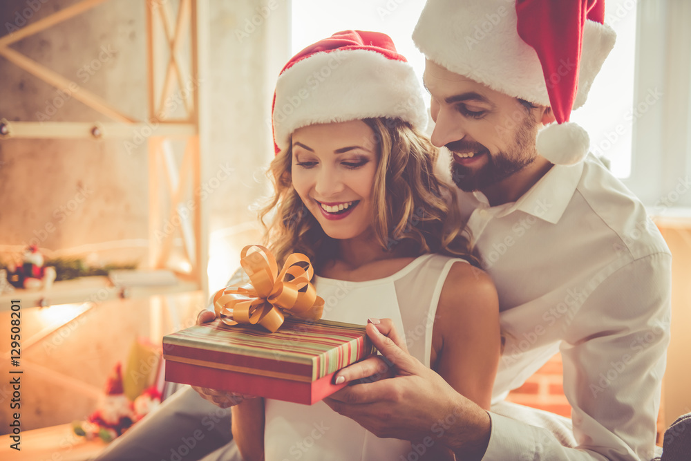 Beautiful couple celebrating Christmas Beautiful couple celebrating Christmas