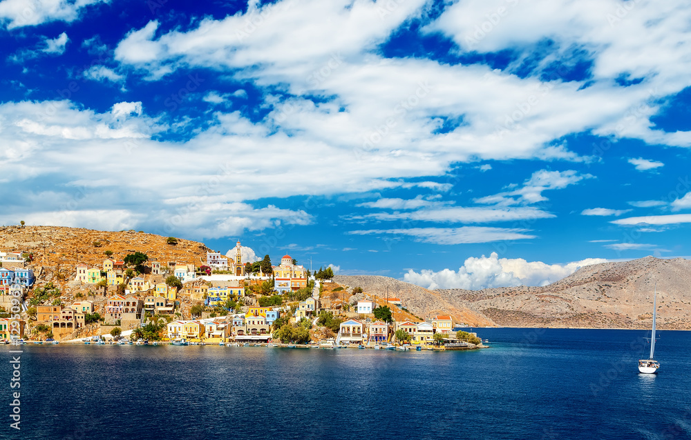Naklejka premium One small and pretty island Simi with his colourful buildings, near the Rhodes, Greece. Great view on island from the ferry.