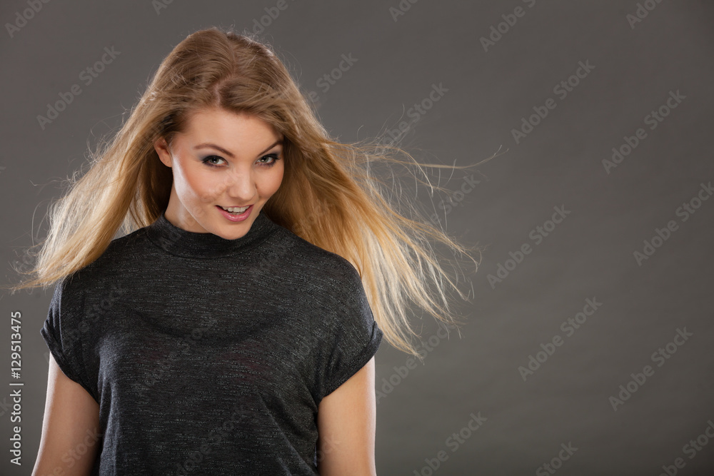 Fototapeta premium Attractive blonde woman with windblown hair