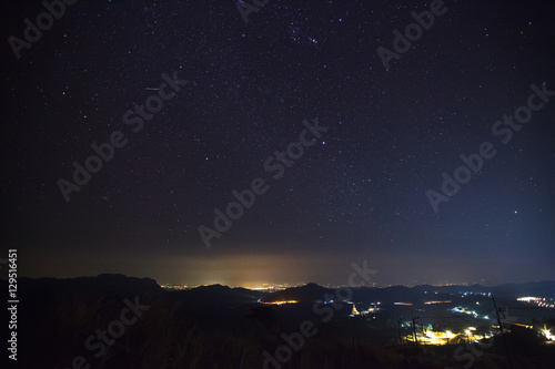 Geminid Meteor in the night sky over Wat Phra That Pha Son Kaew