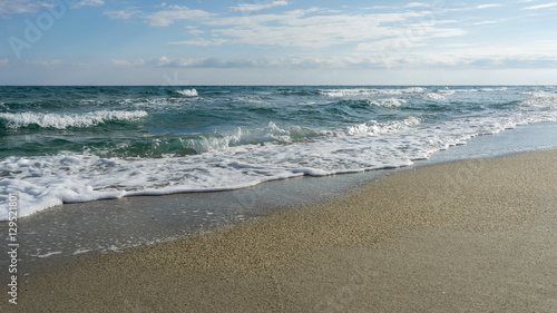 View on Mediterranean Sea with sunny sand beach. Nei Pori village, Pieria, Greece.