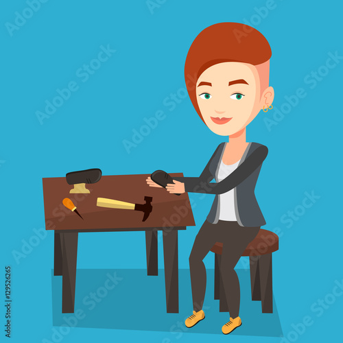 Shoemaker making handmade shoes in workshop.