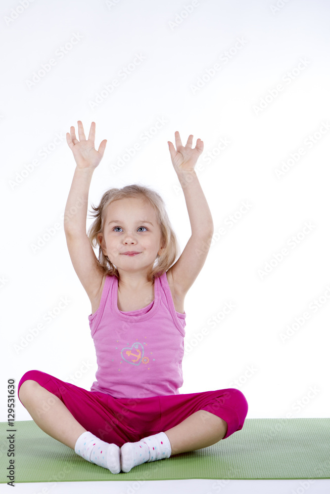 little girl doing gymnastic exercises on the mat little girl doing gymnastic exercises on the mat