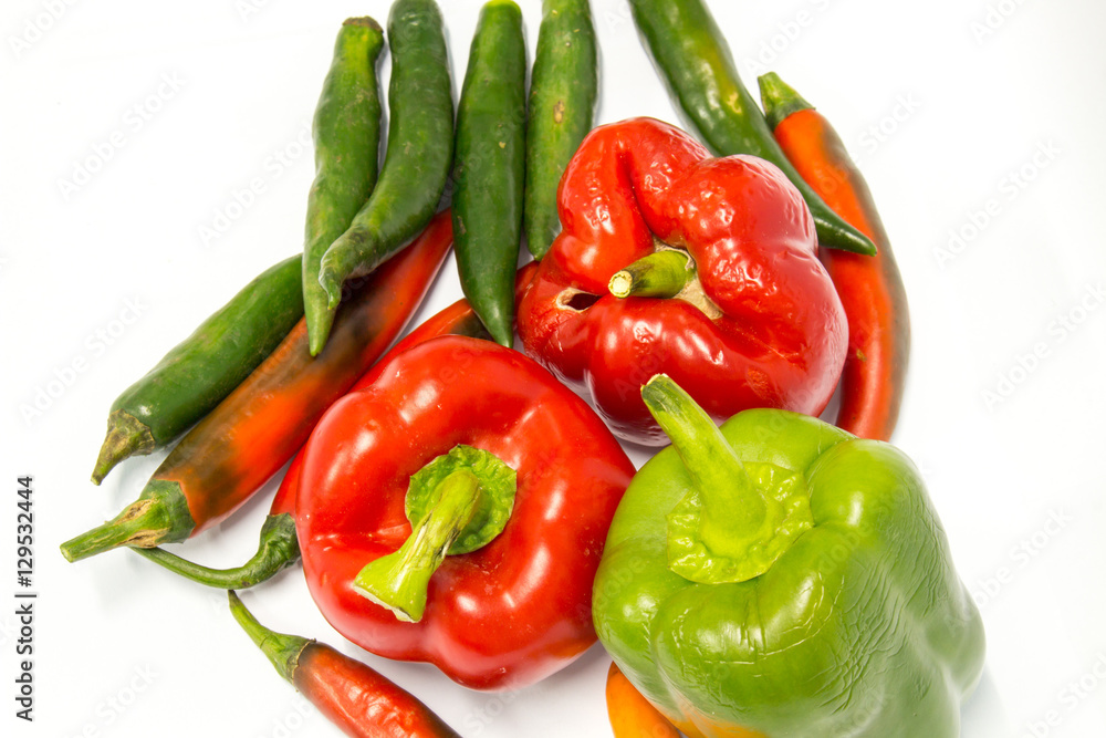 Red and Green peppers isolated on white background Red and Green peppers isolated on white background