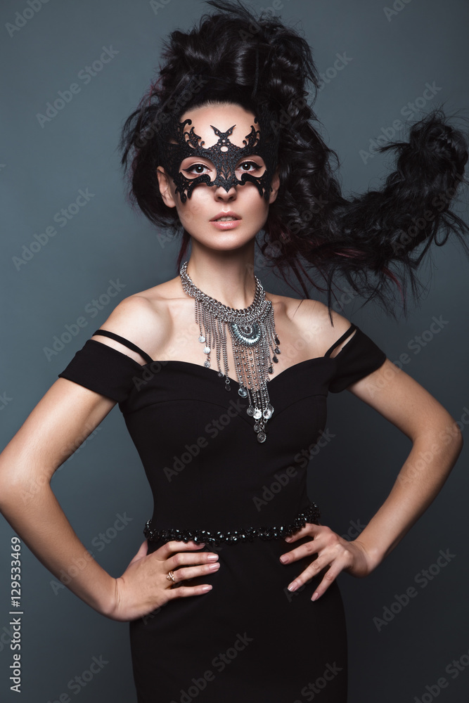 Beautiful girl in evening dress with avant-garde hairstyles. Beauty the face. Photos shot in the studio. Beautiful girl in evening dress with avant-garde hairstyles. Beauty the face. Photos shot in the studio.