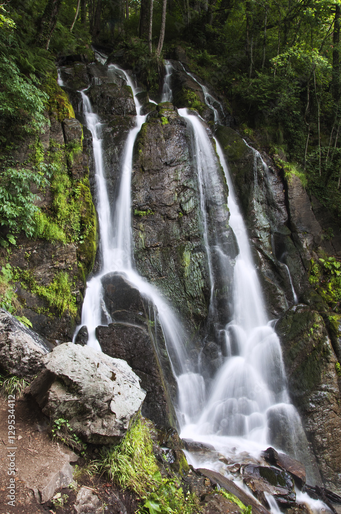 Beautiful waterfall in a mountain forest Beautiful waterfall in a mountain forest