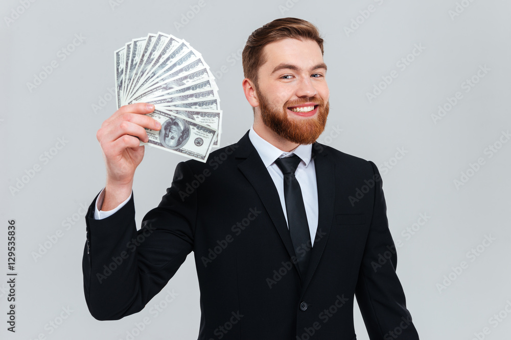 Happy business man holding money in hand Happy business man holding money in hand