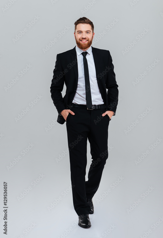 Full length business man with hands in pockets Full length business man with hands in pockets
