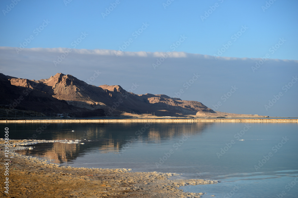 Dead Sea and the coast, lit by the sun in the evening
