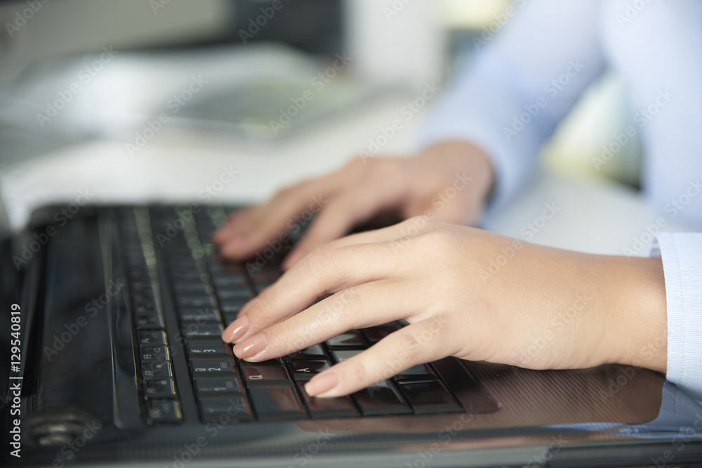Close-up shot of woman hands while typing on keyboard Close-up shot of woman hands while typing on keyboard
