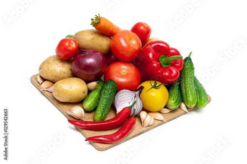 vegetables on a cutting board on white background